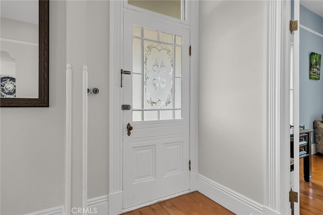 foyer entrance with hardwood / wood-style flooring