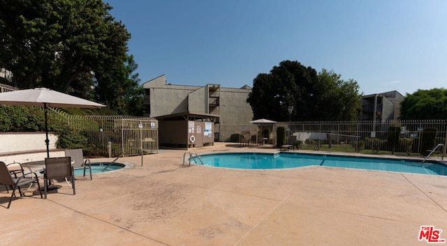 view of pool featuring a patio