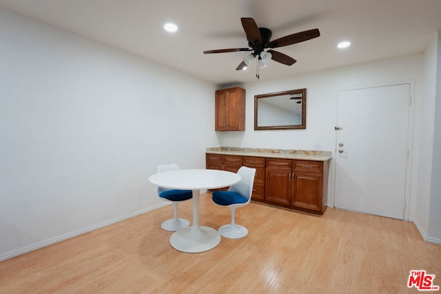 kitchen featuring ceiling fan and light wood-type flooring