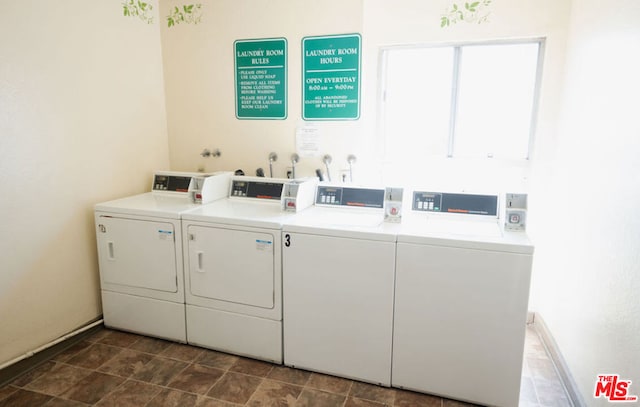 clothes washing area with separate washer and dryer