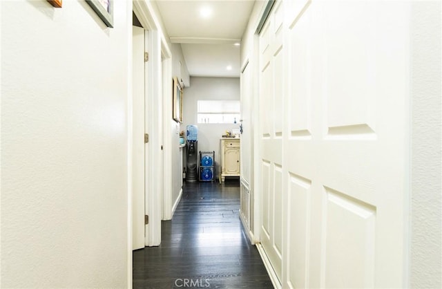 corridor featuring dark hardwood / wood-style floors