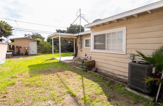 view of yard with central AC