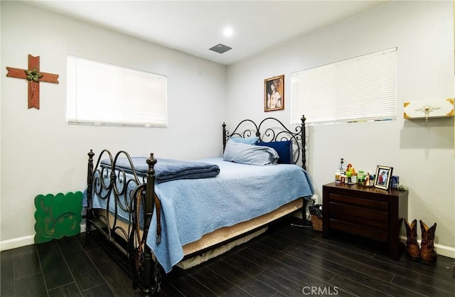 bedroom featuring dark hardwood / wood-style flooring