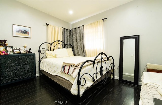 bedroom featuring dark hardwood / wood-style flooring