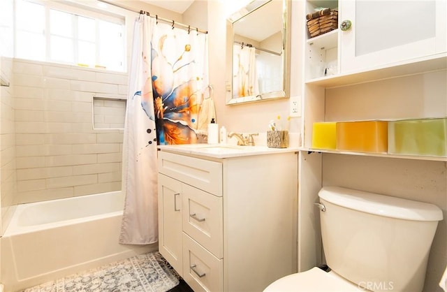 full bathroom with shower / tub combo, vanity, and toilet