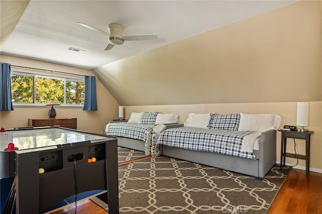 interior space with lofted ceiling, dark wood-type flooring, and ceiling fan