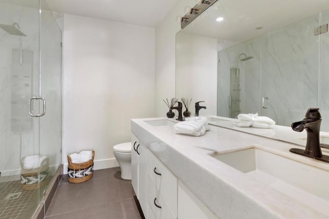 bathroom featuring an enclosed shower, vanity, tile patterned floors, and toilet