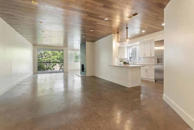 unfurnished living room featuring wooden ceiling