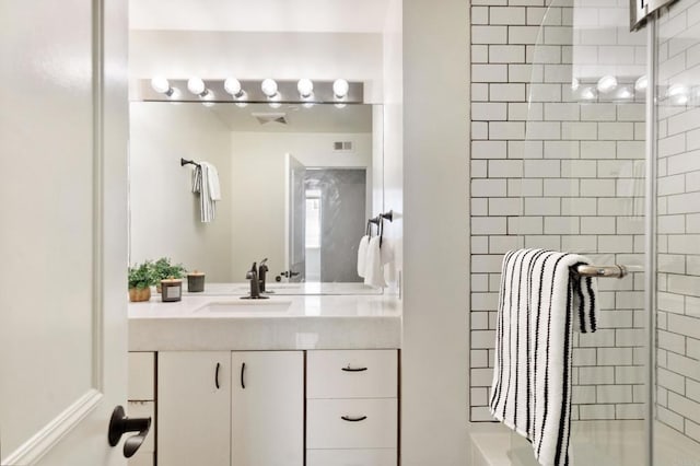 bathroom with vanity and an enclosed shower