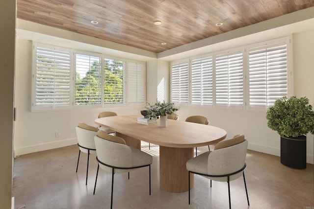 dining space with wood ceiling