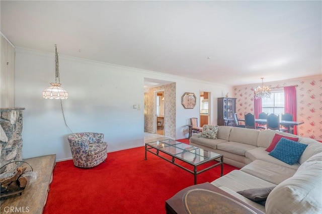 living room featuring an inviting chandelier, ornamental molding, and carpet