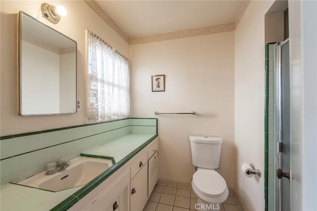 bathroom with vanity, an enclosed shower, tile patterned floors, and toilet