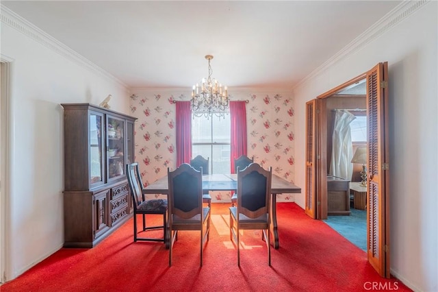 dining room with crown molding, a chandelier, and carpet flooring