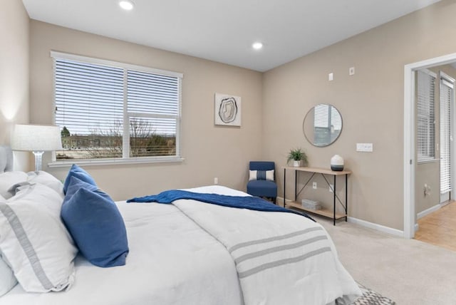 bedroom with light colored carpet