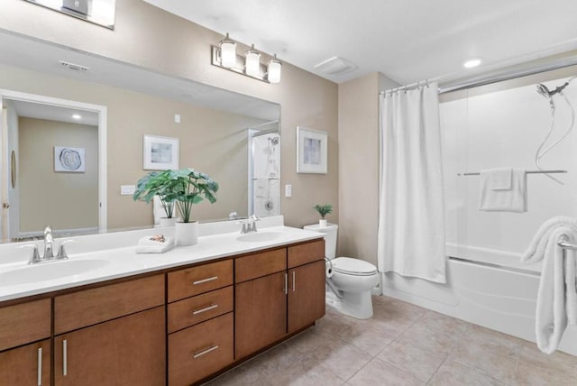 full bathroom featuring tile patterned flooring, vanity, toilet, and shower / bath combo with shower curtain