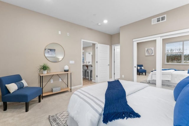 bedroom featuring light carpet