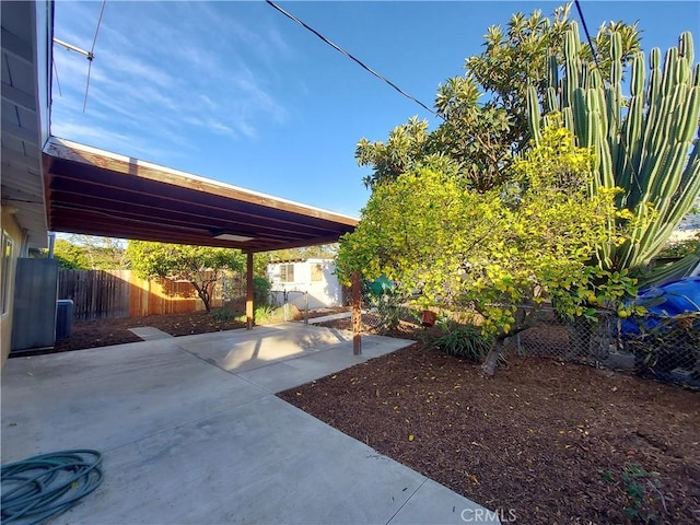 view of yard featuring central AC unit and a patio