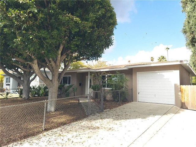 ranch-style home featuring a garage