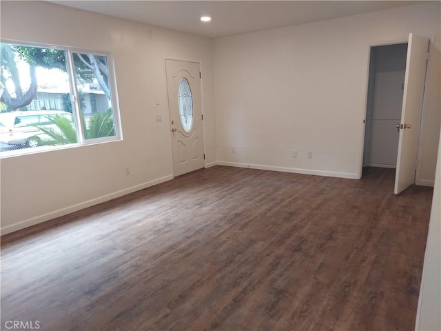 foyer with dark hardwood / wood-style floors