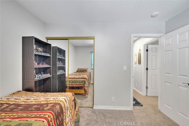 bedroom featuring carpet flooring and a closet