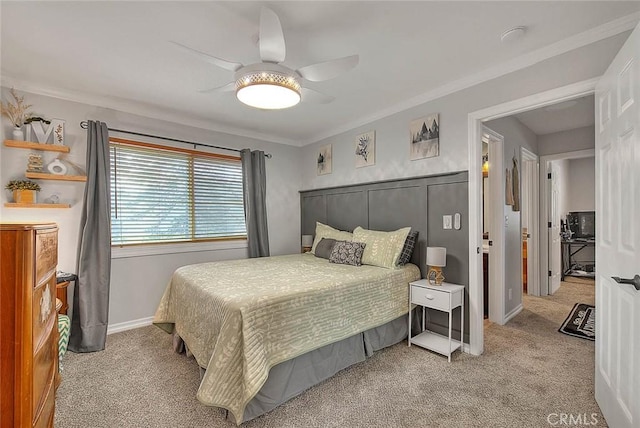 carpeted bedroom with ornamental molding and ceiling fan