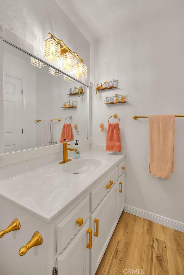 bathroom with vanity and hardwood / wood-style floors