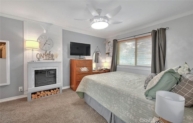 carpeted bedroom featuring ceiling fan and a high end fireplace