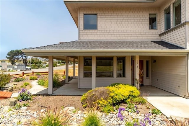 property entrance with a carport