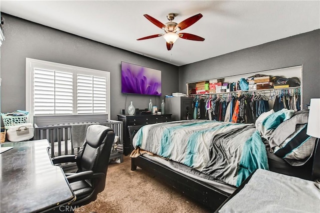 bedroom featuring a closet, ceiling fan, and carpet flooring