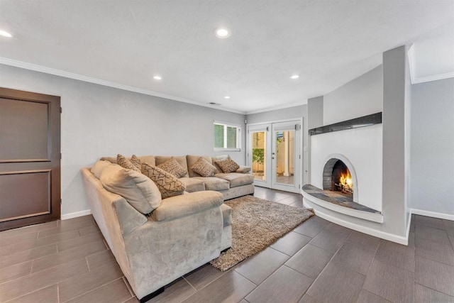 living room with crown molding and french doors