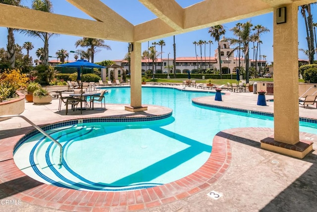 view of swimming pool with a patio area