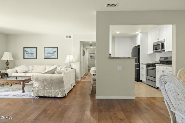 living room with wood-type flooring