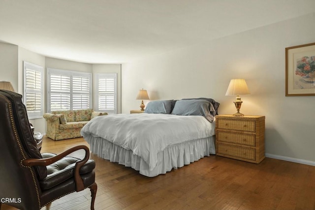 bedroom featuring dark wood-type flooring