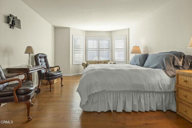 bedroom with hardwood / wood-style floors