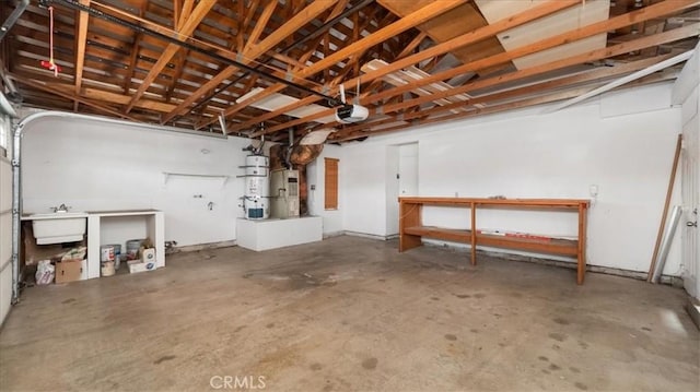 garage featuring a garage door opener, sink, and water heater