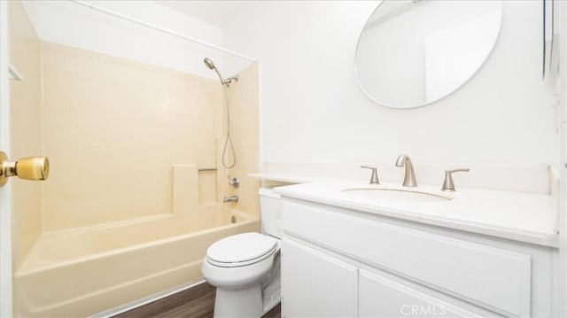 full bathroom with vanity, hardwood / wood-style floors, shower / tub combination, and toilet