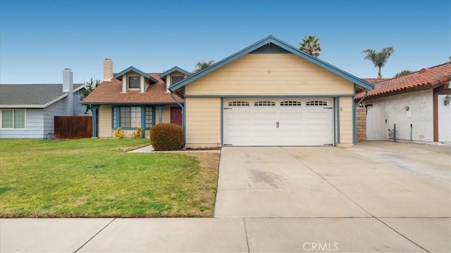 view of front of property with a garage and a front yard