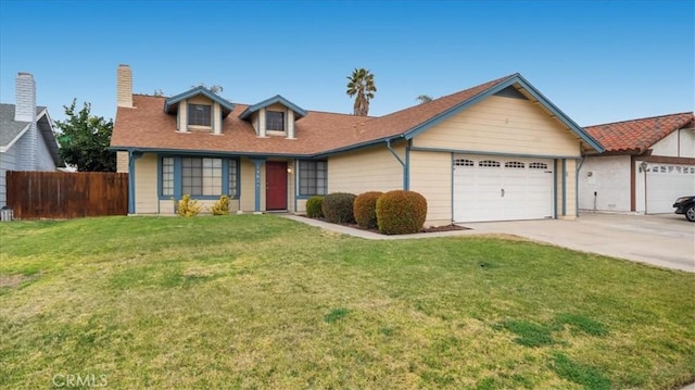 view of front of house featuring a garage and a front yard