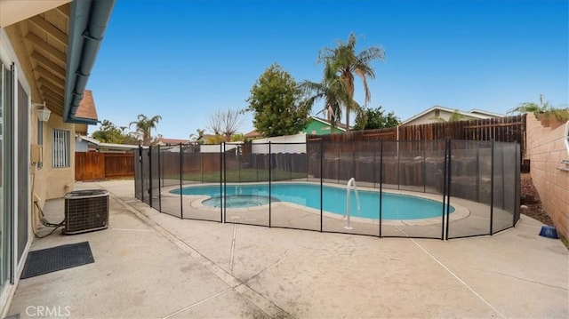 view of swimming pool featuring a patio and cooling unit