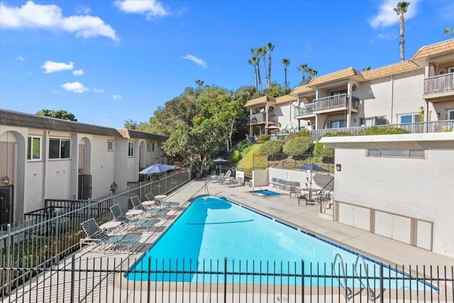 view of swimming pool featuring a patio area