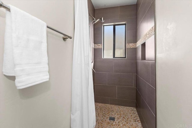 bathroom featuring a shower with curtain