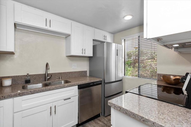 kitchen with white cabinetry, sink, and appliances with stainless steel finishes