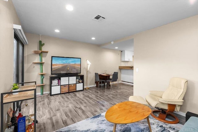 sitting room featuring light hardwood / wood-style floors