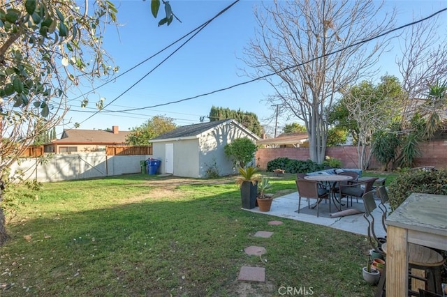 view of yard with an outdoor structure and a patio area