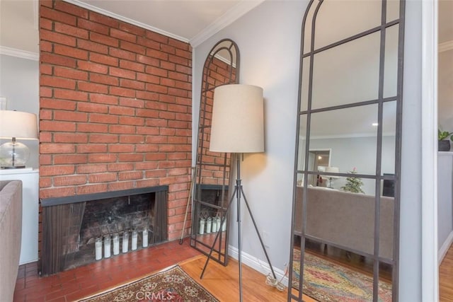 living room with hardwood / wood-style flooring, ornamental molding, and a fireplace