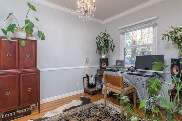 office space with ornamental molding, an inviting chandelier, and light hardwood / wood-style flooring