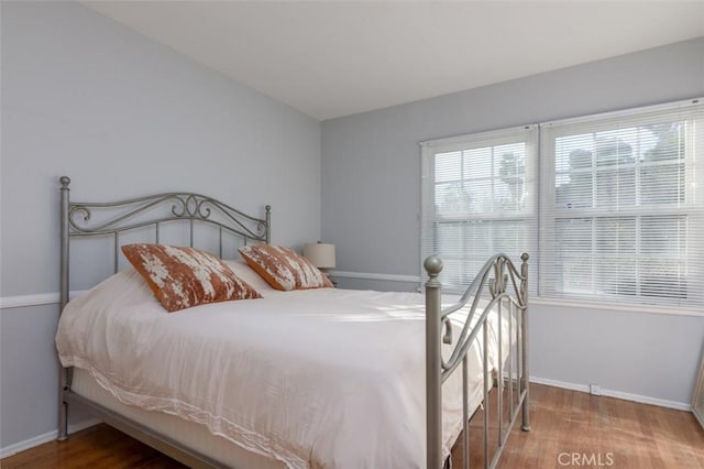 bedroom featuring hardwood / wood-style floors