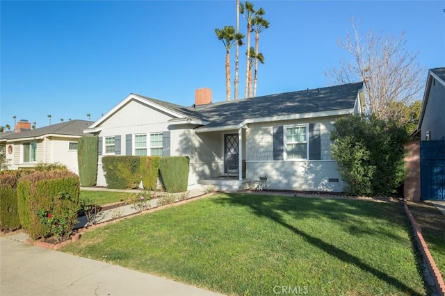 single story home with a front yard