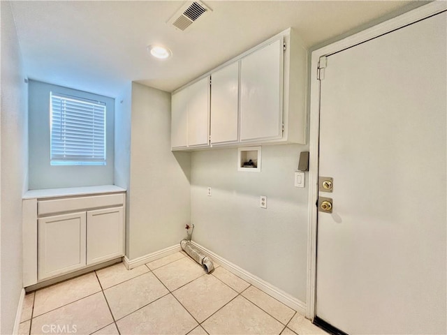 laundry room with light tile patterned flooring, cabinets, gas dryer hookup, and hookup for a washing machine