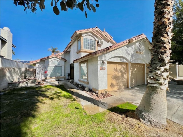 mediterranean / spanish home featuring a front lawn